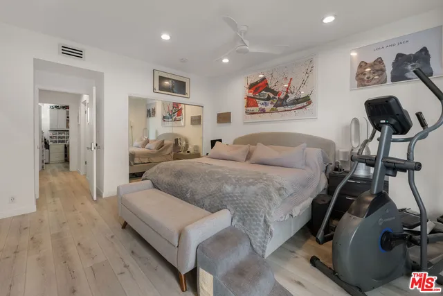 a bedroom with a bed and the view of bathroom