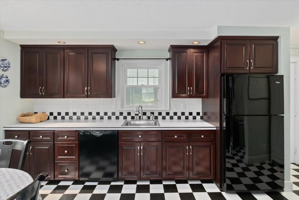 16 Sturges Road Boston, MA 02132 - Photo 11 of 34 a kitchen with a sink a stove and refrigerator