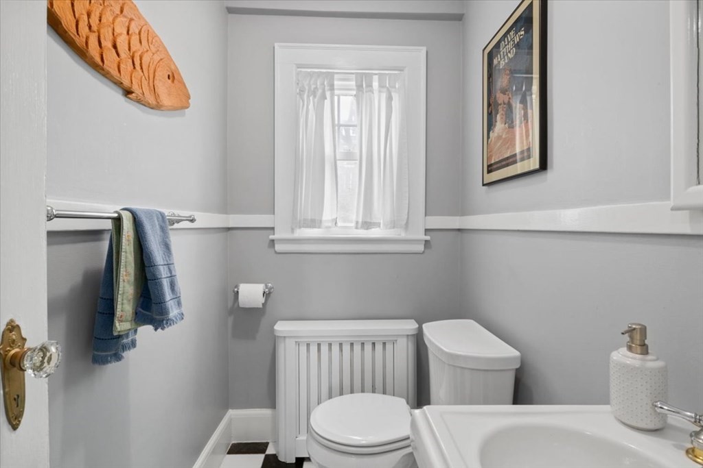 16 Sturges Road Boston, MA 02132 - Photo 13 of 34 a white toilet sitting next to a bathroom sink