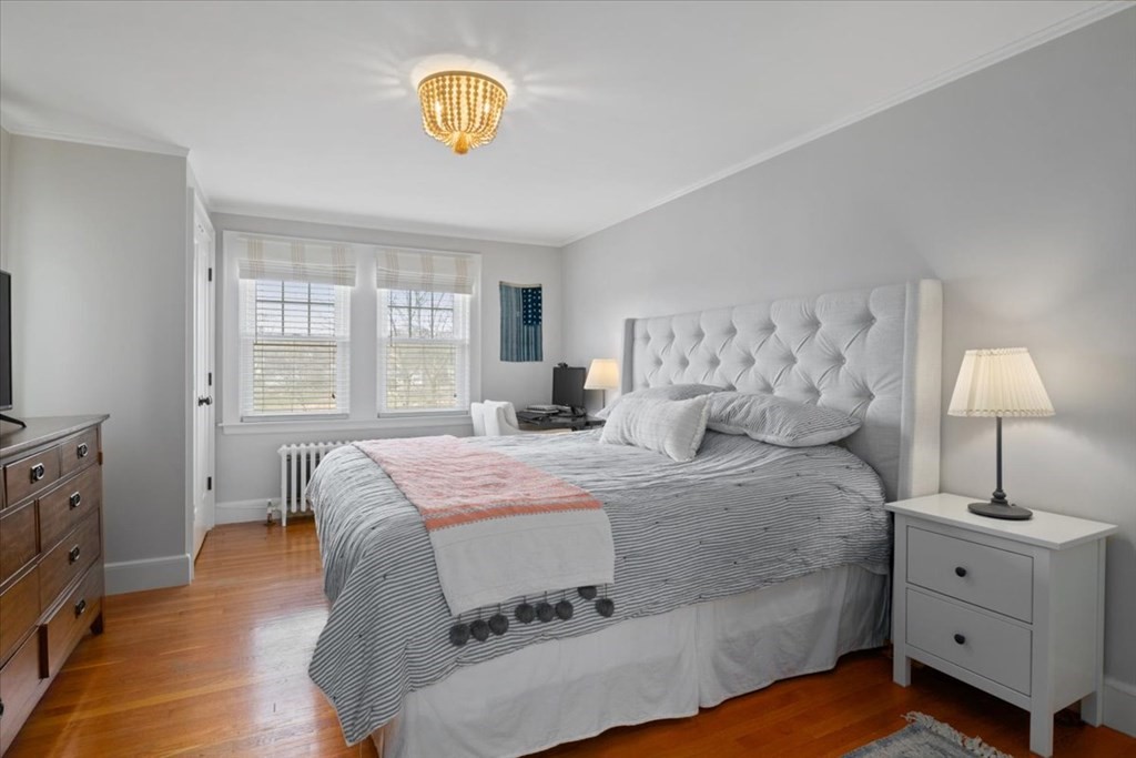 16 Sturges Road Boston, MA 02132 - Photo 14 of 34 a spacious bedroom with a bed and a window