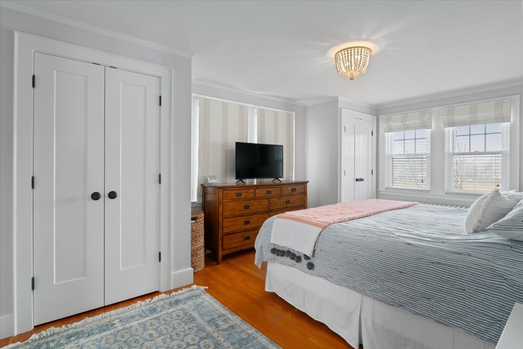 16 Sturges Road Boston, MA 02132 - Photo 15 of 34 a bedroom with a bed and a flat screen tv