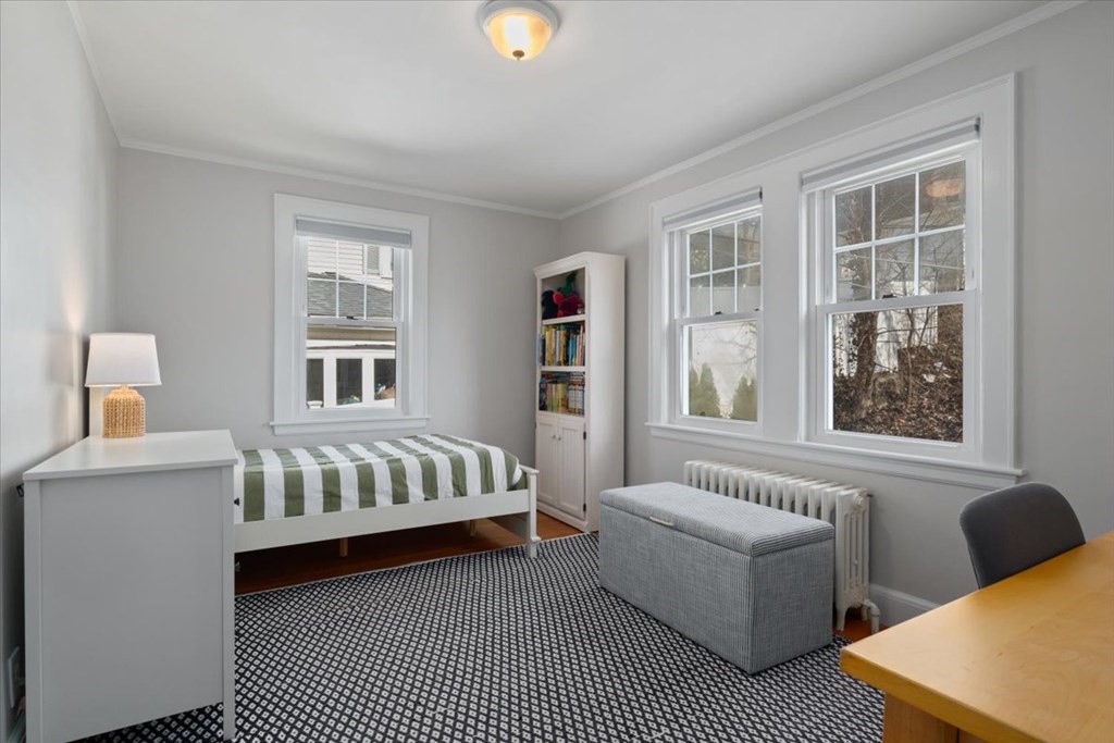 16 Sturges Road Boston, MA 02132 - Photo 17 of 34 a bedroom with furniture and a window