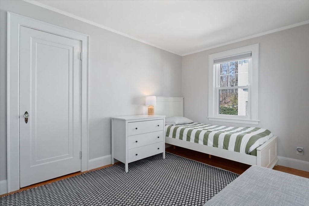 16 Sturges Road Boston, MA 02132 - Photo 18 of 34 a bedroom with a bed and a window