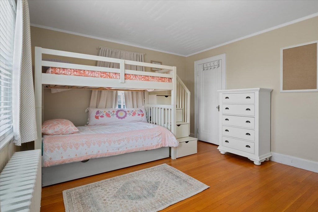 16 Sturges Road Boston, MA 02132 - Photo 19 of 34 a bedroom with a bed and a window