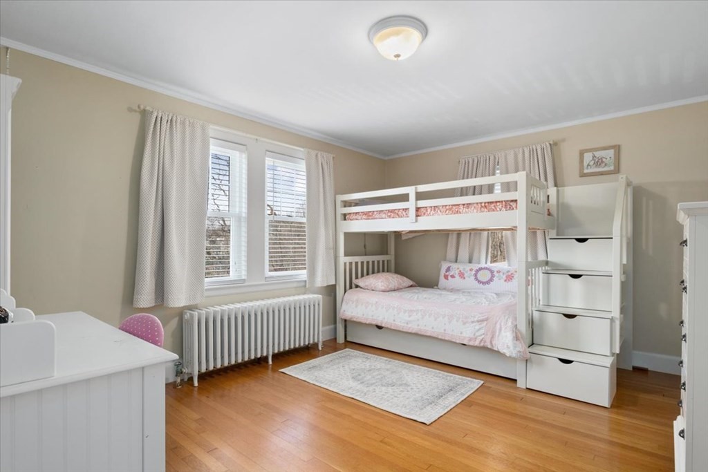 16 Sturges Road Boston, MA 02132 - Photo 20 of 34 a bedroom with a bed and a window