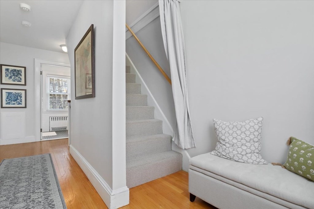 16 Sturges Road Boston, MA 02132 - Photo 22 of 34 a living room with furniture and a rug