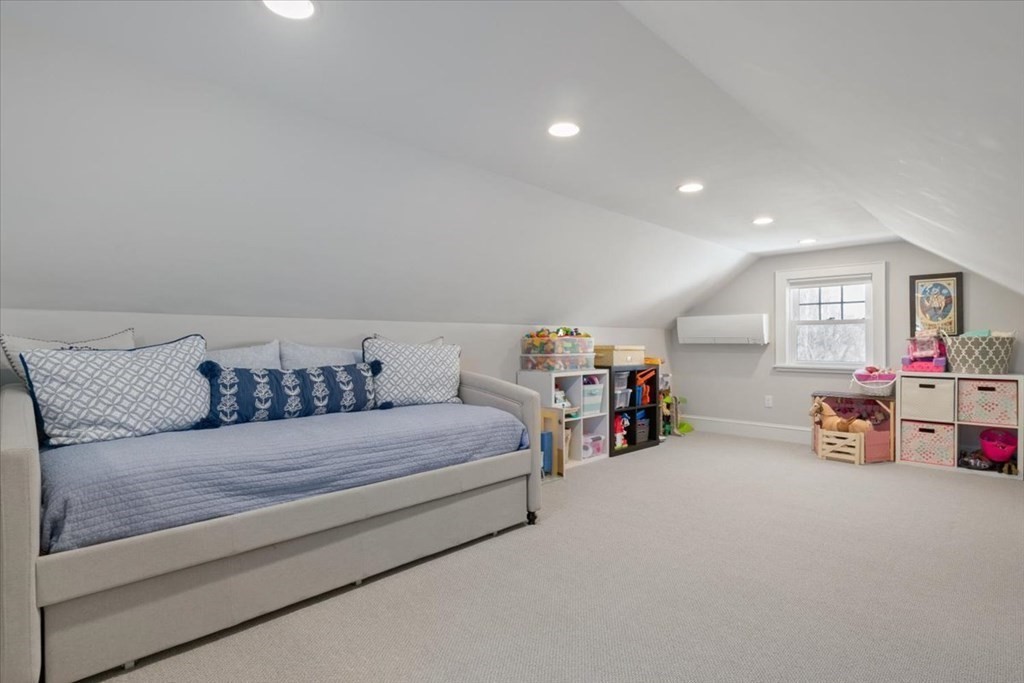 16 Sturges Road Boston, MA 02132 - Photo 23 of 34 a spacious bedroom with a bed and a couch