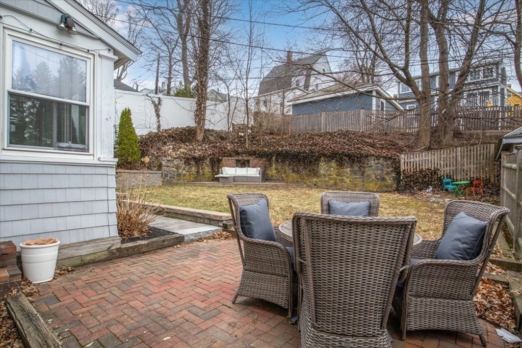 16 Sturges Road Boston, MA 02132 - Photo 25 of 34 a view of a patio with couches chairs and wooden floor