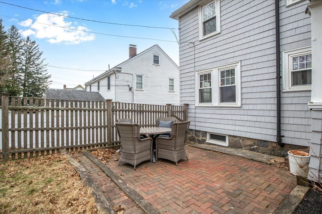 16 Sturges Road Boston, MA 02132 - Photo 28 of 34 a view of a house with a patio and a yard
