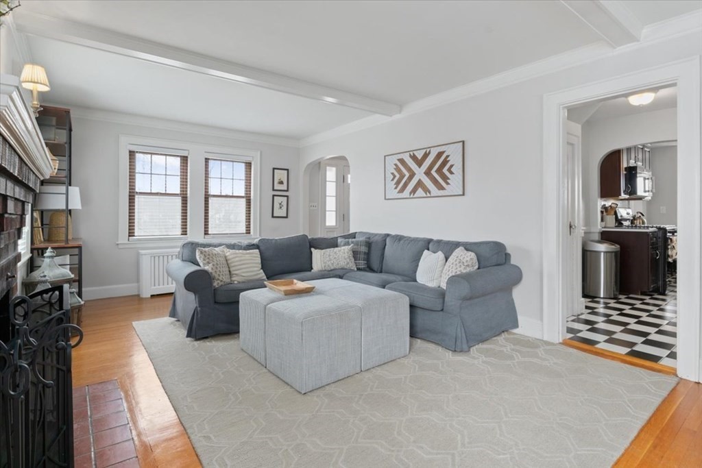 16 Sturges Road Boston, MA 02132 - Photo 3 of 34 a living room with furniture and a flat screen tv