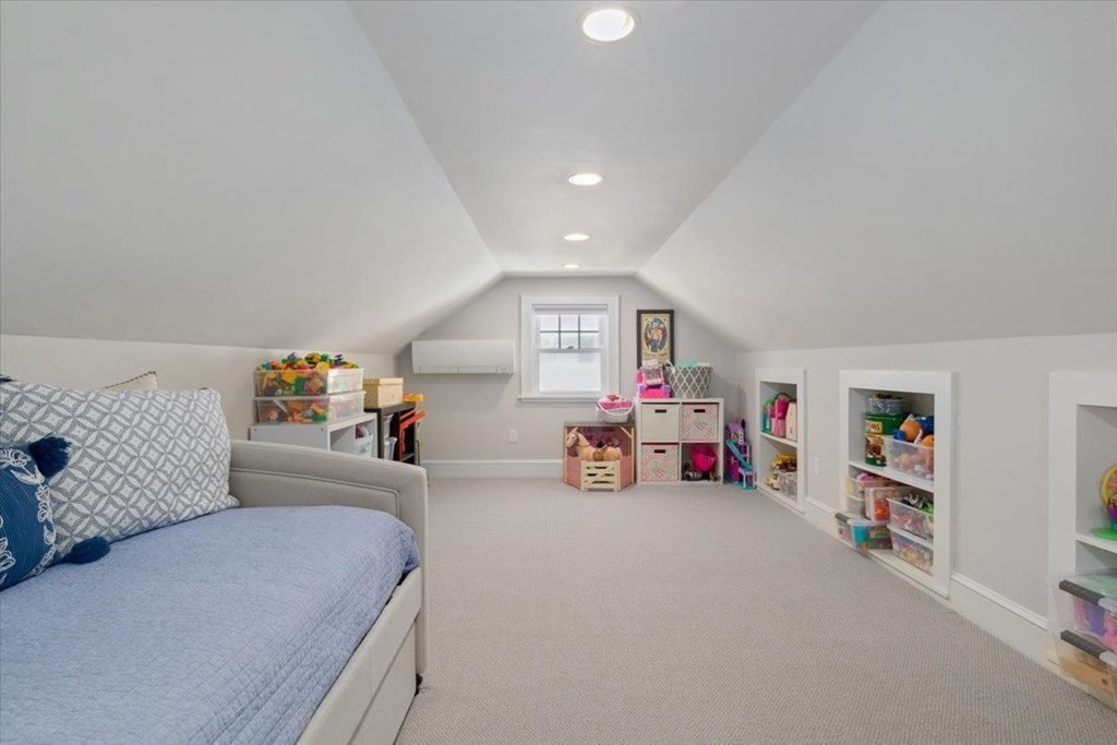 16 Sturges Road Boston, MA 02132 - Photo 7 of 34 a bedroom with furniture and a book shelf