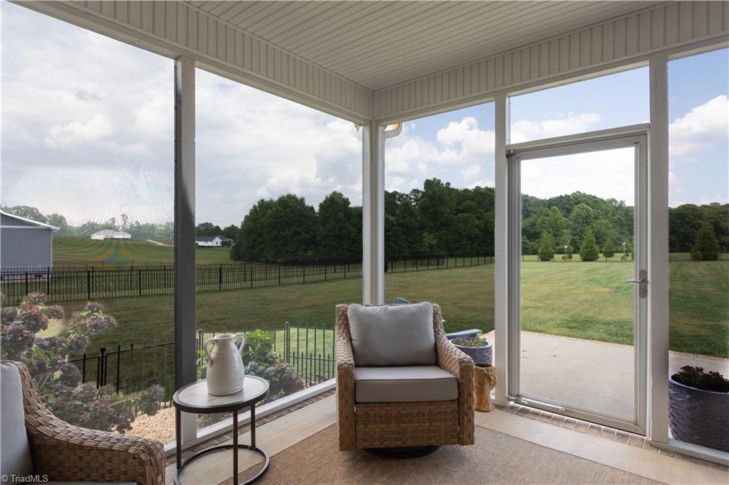 393 Scout Road Lexington, NC 27292 - Photo 12 of 47 The backyard is huge and fenced! Sit right here and relax while allowing your furry friends to run and play.