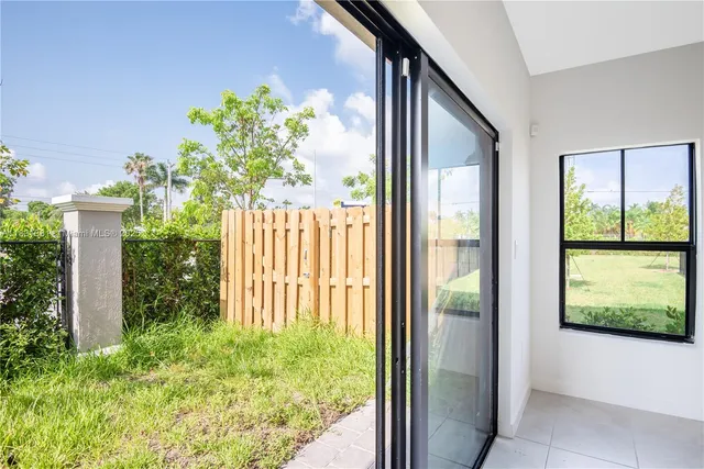 a view of a garden with palm trees