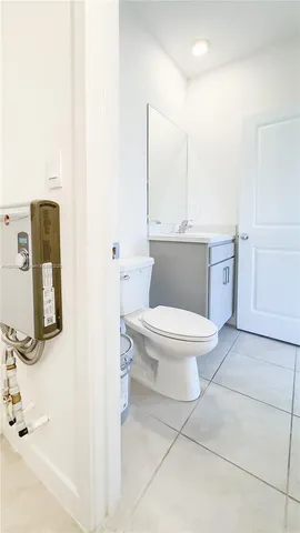 a close view of a utility room with dryer and washer