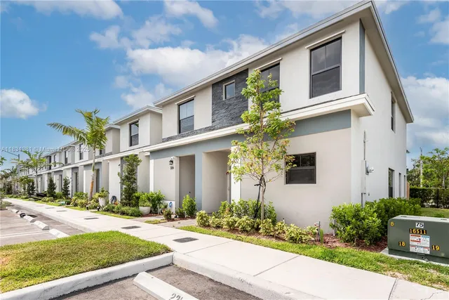 a front view of a house with yard