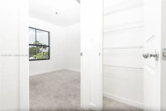 an empty room with a large window