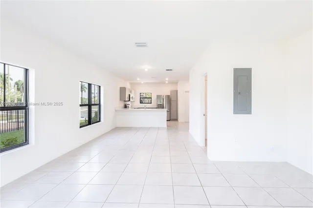 a kitchen with cabinets and white appliances