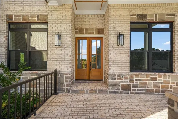 a view of a brick house with a large windows