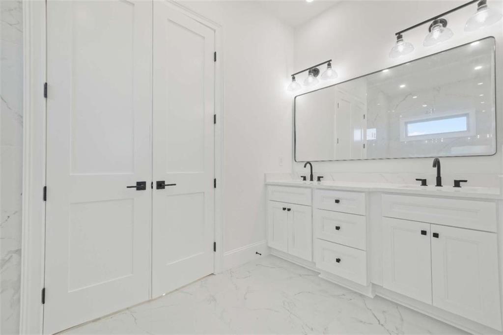1525 Tapestry Ridge Southeast Lawrenceville, GA 30045 - Photo 26 of 49 a bathroom with double sink and a mirror