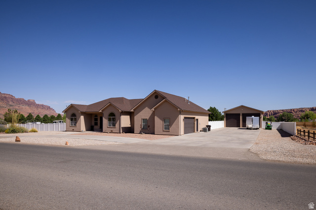 4635 East Sunny Acres Lane Moab, UT 84532 - Photo 16 of 56 Single-story stucco residence featuring a two-car garage and an additional detached two-car garage
