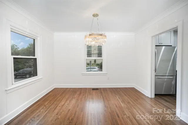 a room with window and wooden floor