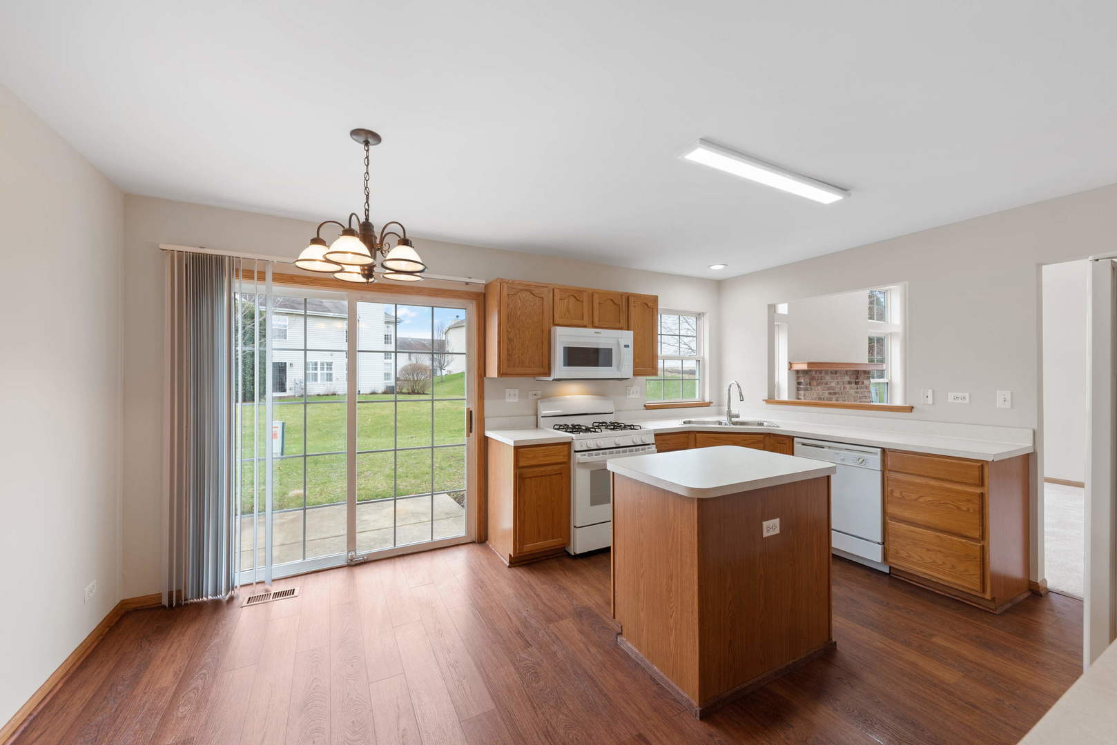 2267 Scott Lane Aurora, IL 60502 - Photo 11 of 22 a kitchen with stainless steel appliances granite countertop a stove and a wooden floors