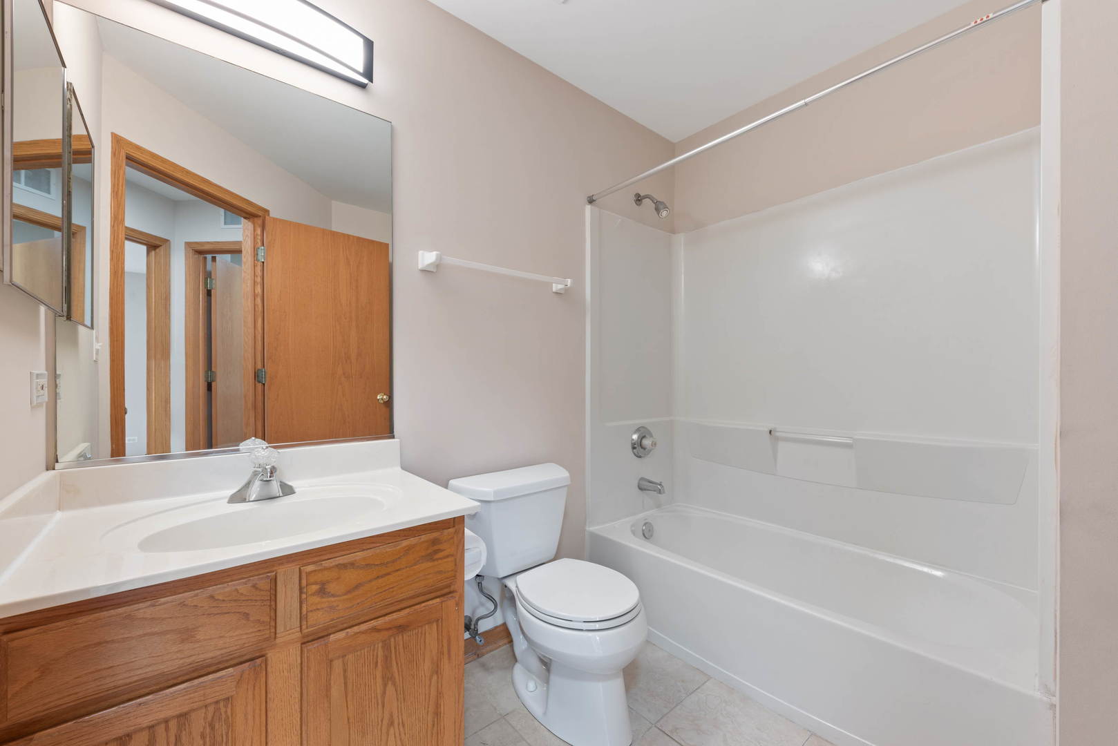 2267 Scott Lane Aurora, IL 60502 - Photo 21 of 22 a bathroom with a sink toilet and shower
