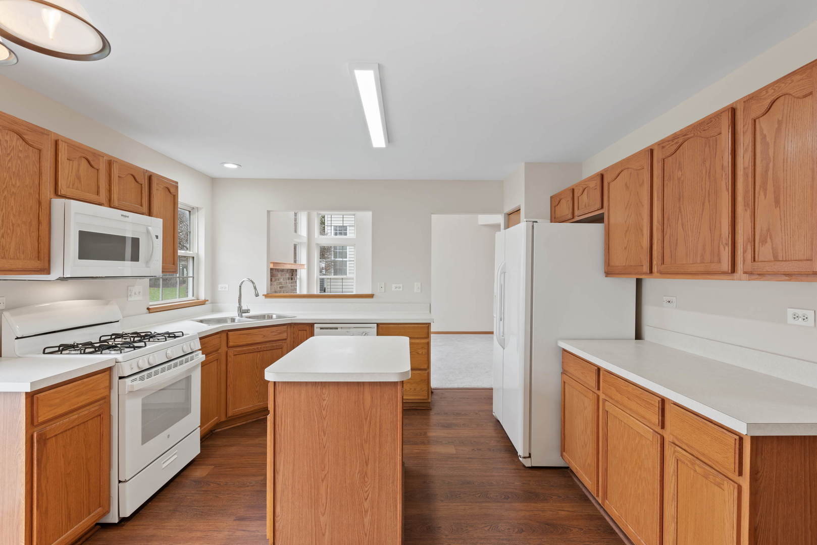 2267 Scott Lane Aurora, IL 60502 - Photo 10 of 22 a kitchen with stainless steel appliances granite countertop a sink stove and refrigerator