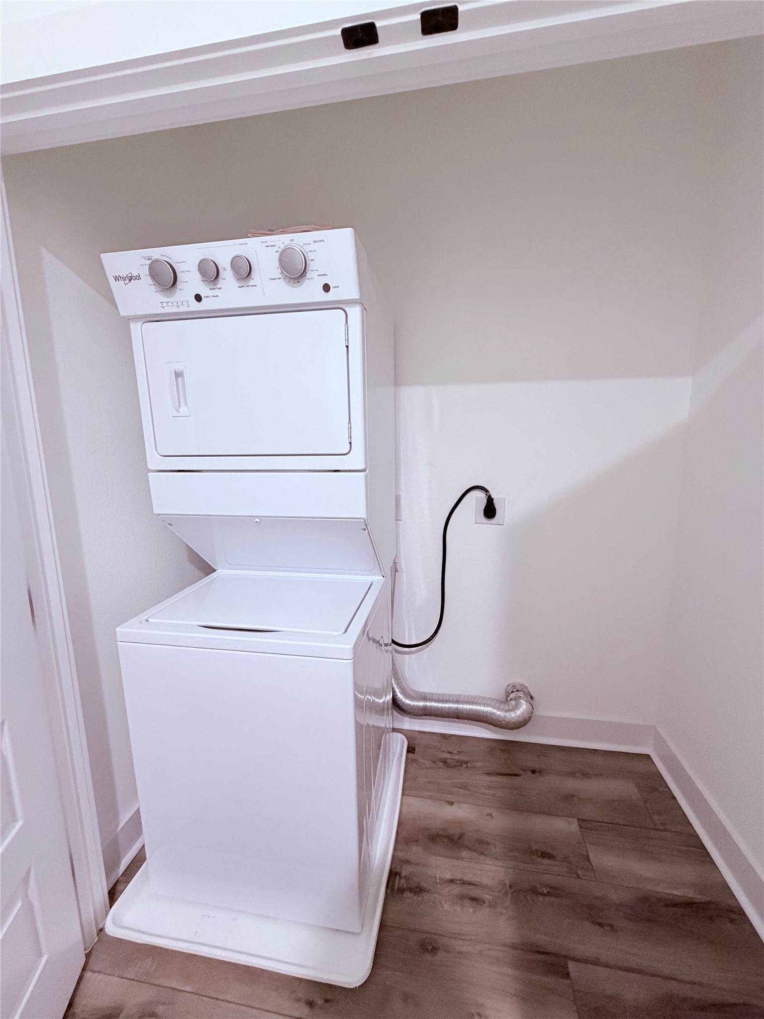 1417 Kramer Lane, Unit 7 Austin, TX 78758 - Photo 3 of 24 A dedicated laundry space provides ultimate convenience with a stacked washer and dryer.