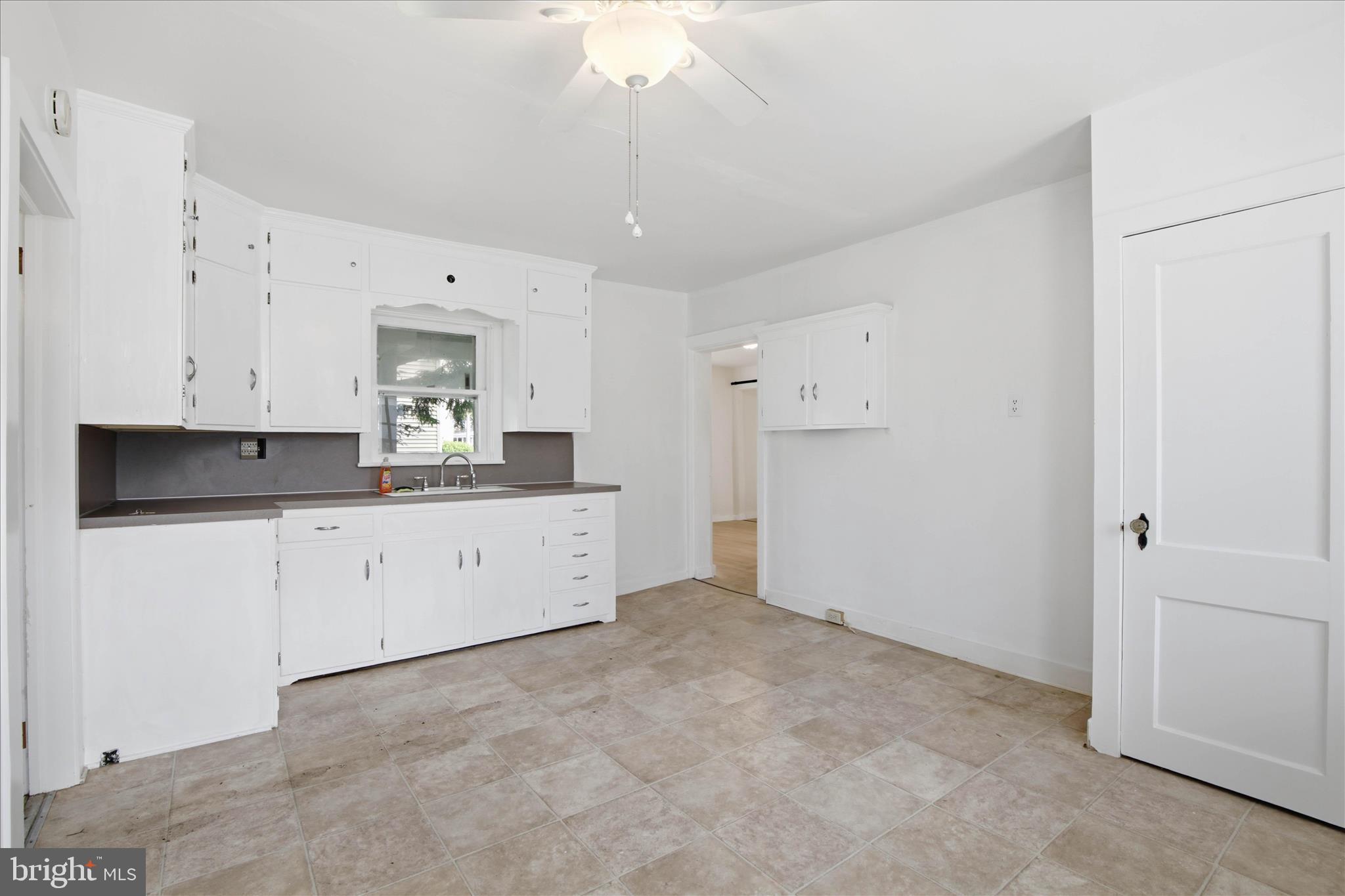 101 East Lincoln Avenue Lititz, PA 17543 - Photo 7 of 39 a kitchen with cabinets appliances and a ceiling fan