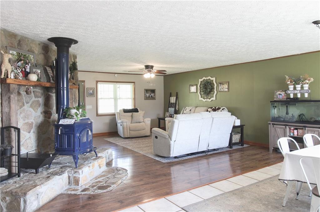 249 Cooper Road Southeast Calhoun, GA 30701 - Photo 11 of 62 a living room with furniture and a fireplace