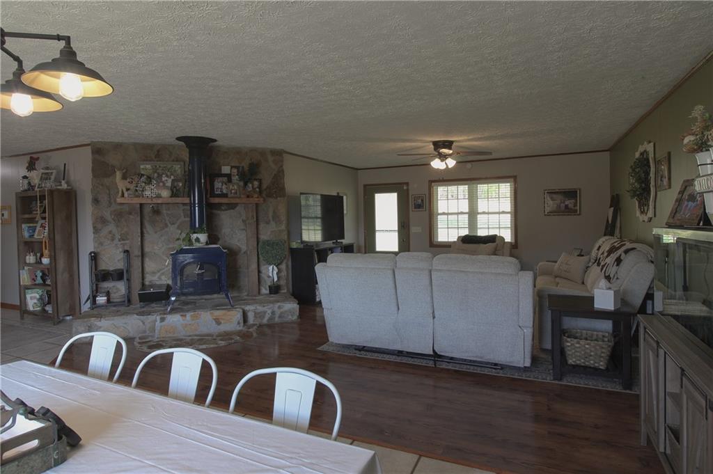249 Cooper Road Southeast Calhoun, GA 30701 - Photo 12 of 62 a living room with furniture and a flat screen tv