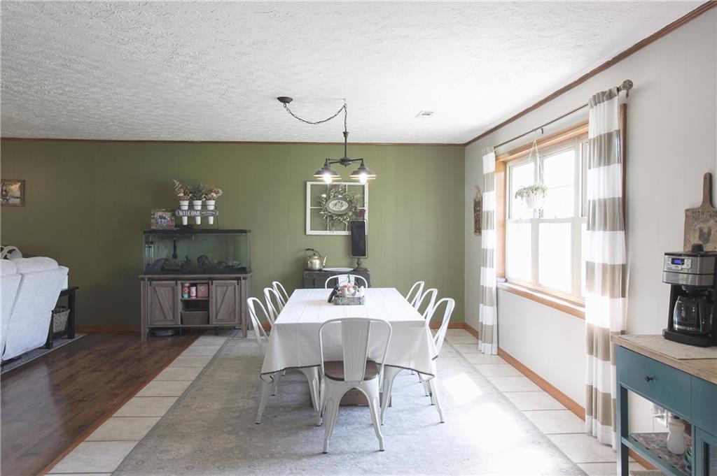 249 Cooper Road Southeast Calhoun, GA 30701 - Photo 13 of 62 a dining room with furniture and window