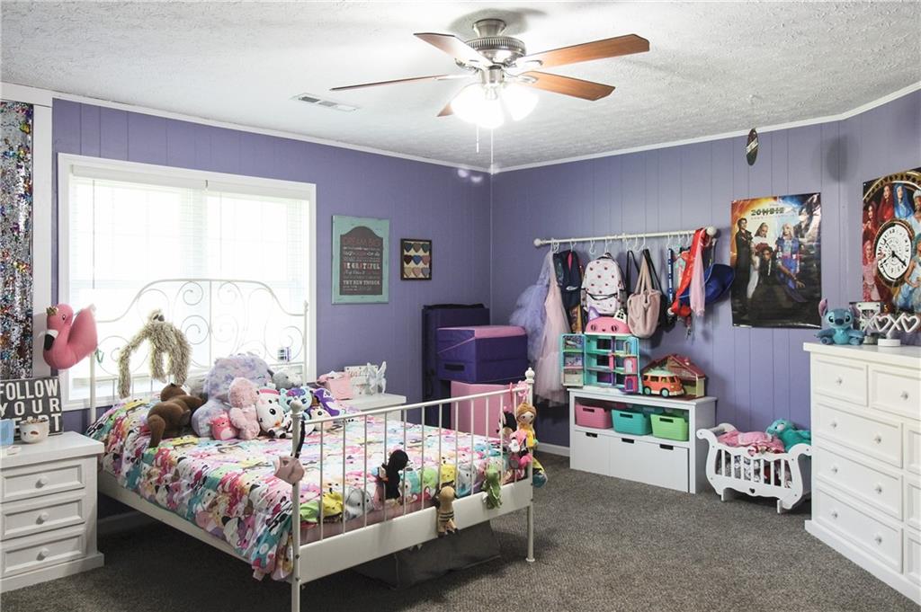 249 Cooper Road Southeast Calhoun, GA 30701 - Photo 19 of 62 a bedroom with a bed and a window