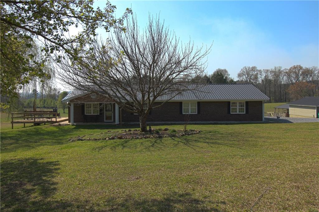 249 Cooper Road Southeast Calhoun, GA 30701 - Photo 2 of 62 a front view of a house with a garden