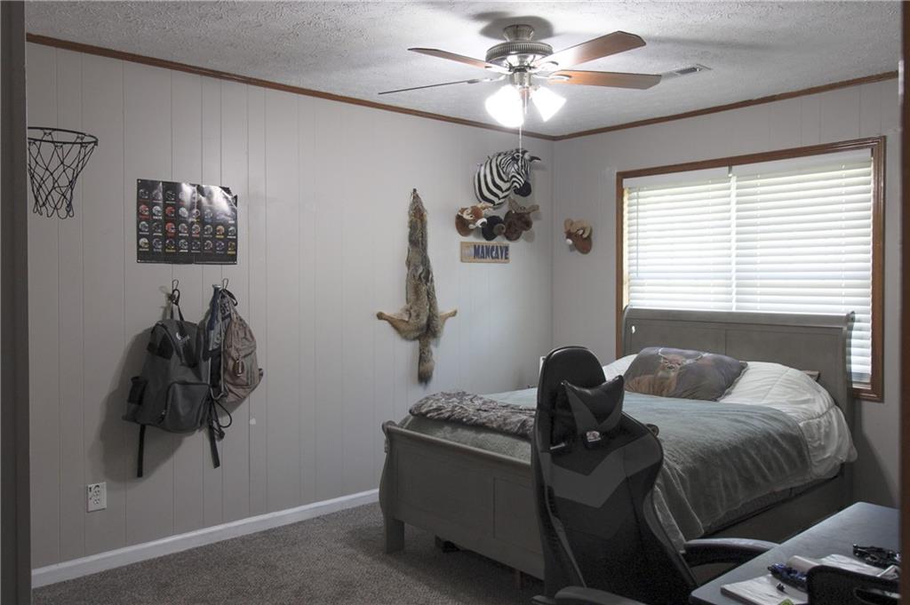 249 Cooper Road Southeast Calhoun, GA 30701 - Photo 23 of 62 a bedroom with a bed and a window