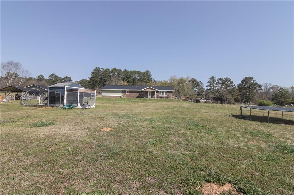 249 Cooper Road Southeast Calhoun, GA 30701 - Photo 43 of 62 a house with river in front of it
