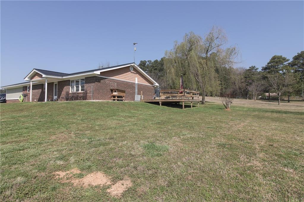 249 Cooper Road Southeast Calhoun, GA 30701 - Photo 45 of 62 a view of a house with a yard and sitting area