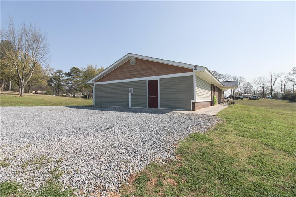 249 Cooper Road Southeast Calhoun, GA 30701 - Photo 50 of 62 a front view of house with yard and trees around