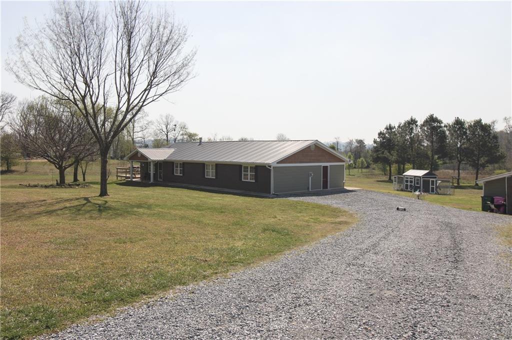 249 Cooper Road Southeast Calhoun, GA 30701 - Photo 5 of 62 a front view of a house with a yard