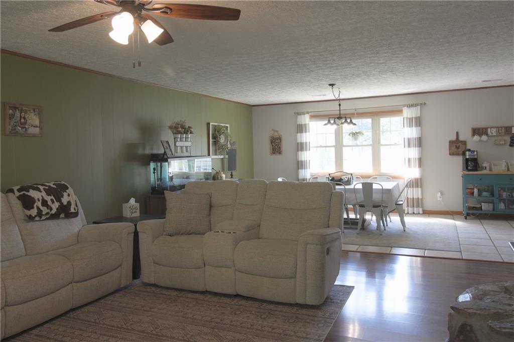 249 Cooper Road Southeast Calhoun, GA 30701 - Photo 7 of 62 a living room with furniture and a large window