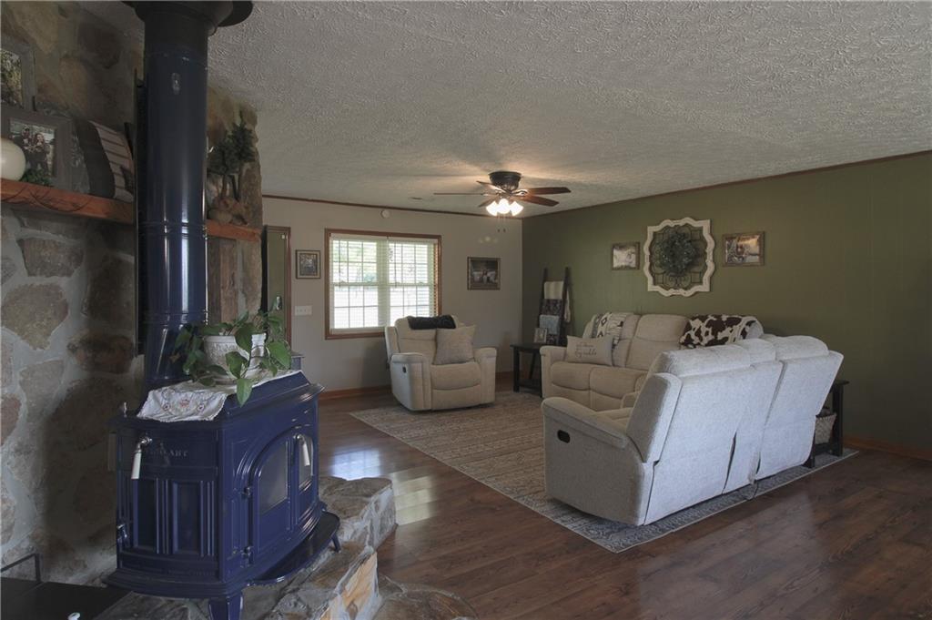 249 Cooper Road Southeast Calhoun, GA 30701 - Photo 9 of 62 a living room with furniture and a chandelier