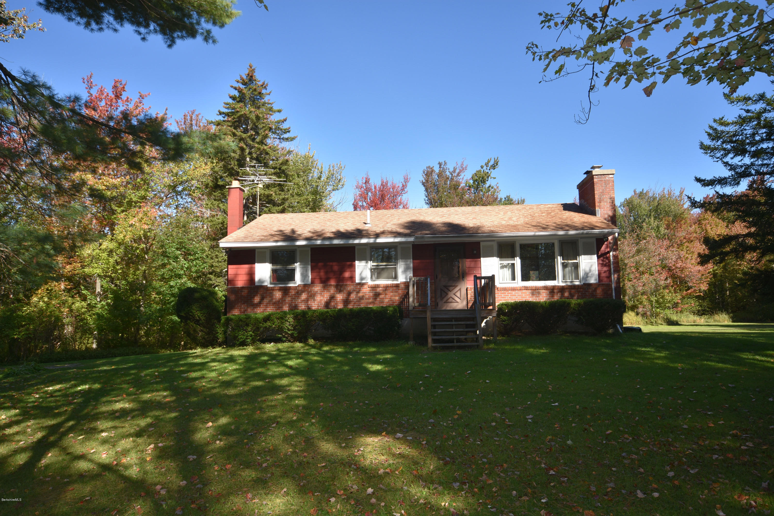 239 East Windsor Road Peru, MA 01235 - Photo 1 of 38 a front view of a house with a garden