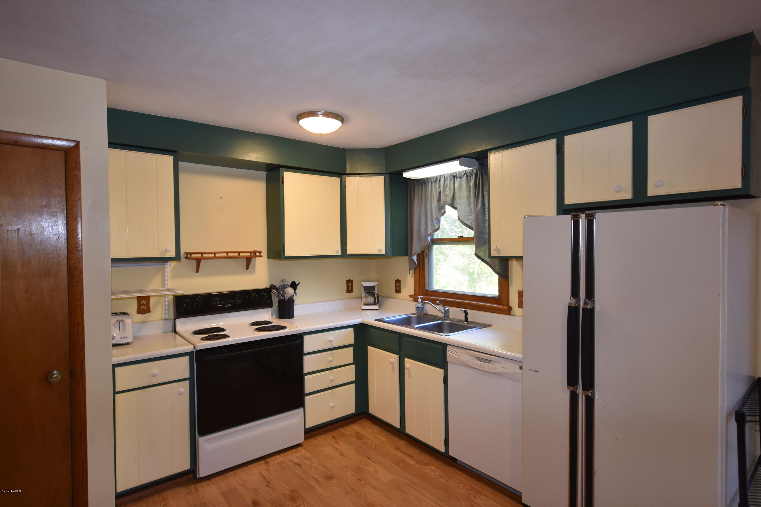 239 East Windsor Road Peru, MA 01235 - Photo 11 of 38 a kitchen with stainless steel appliances a stove sink and cabinets