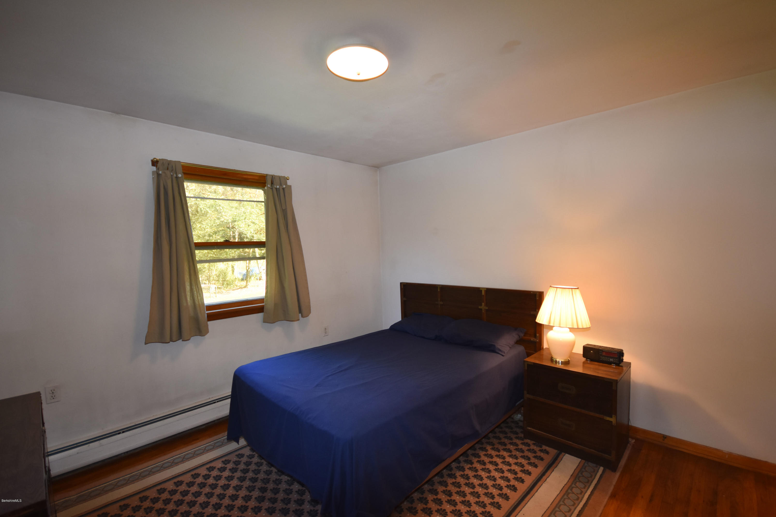 239 East Windsor Road Peru, MA 01235 - Photo 18 of 38 a bedroom with a bed and window