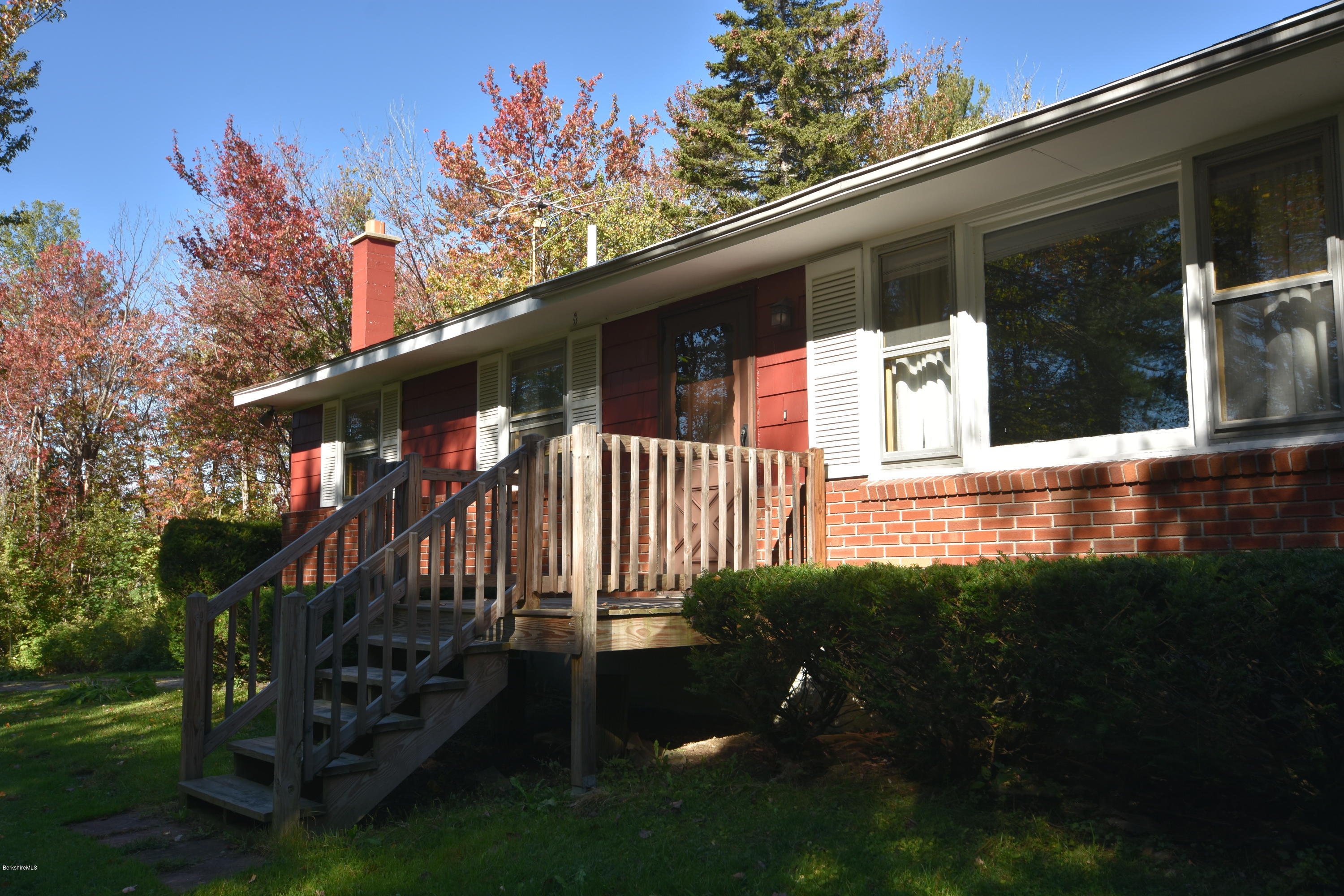 239 East Windsor Road Peru, MA 01235 - Photo 5 of 38 a view of a house with a small yard and a garden