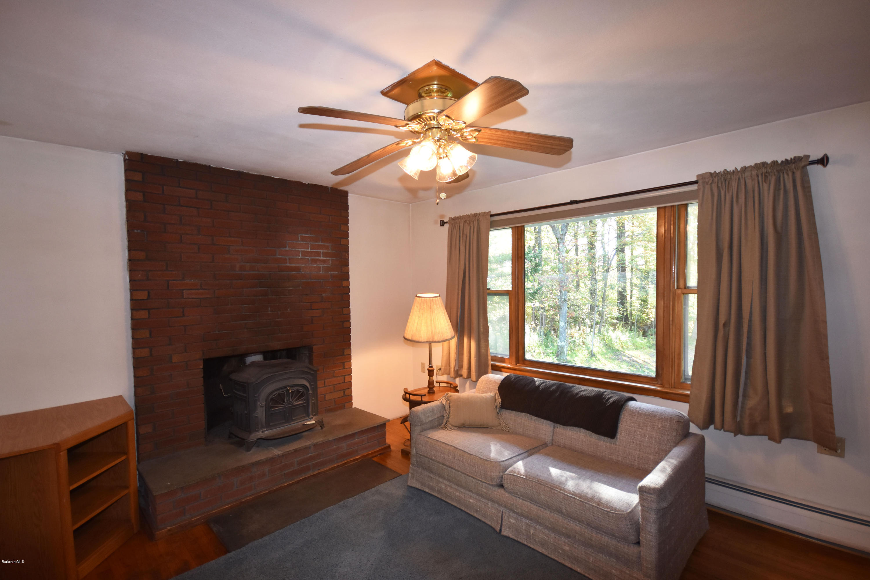 239 East Windsor Road Peru, MA 01235 - Photo 7 of 38 a living room with furniture and a fireplace