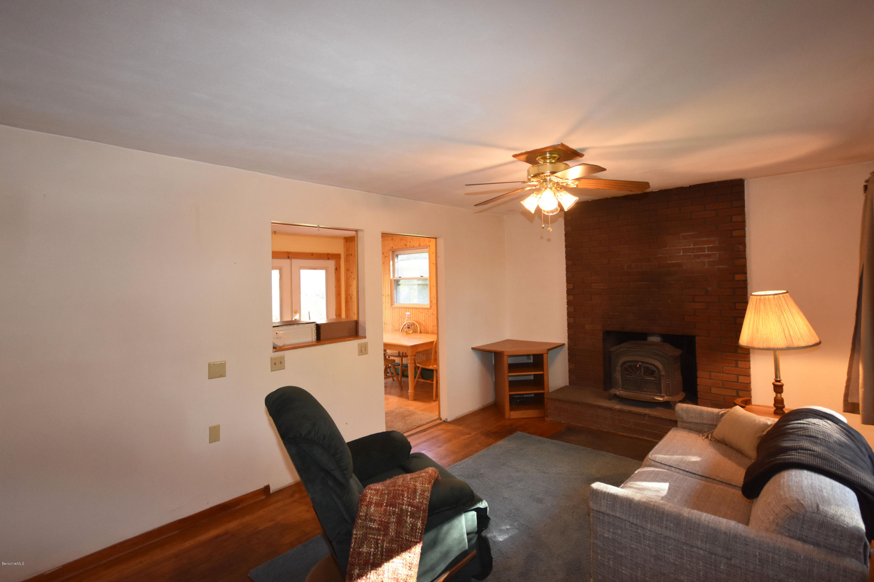 239 East Windsor Road Peru, MA 01235 - Photo 9 of 38 a living room with furniture and a fireplace
