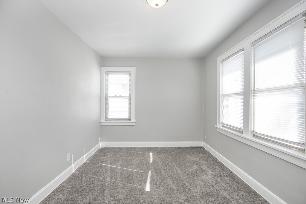 4661 Horton Road Cleveland, OH 44125 - Photo 13 of 27 Empty room featuring dark carpet