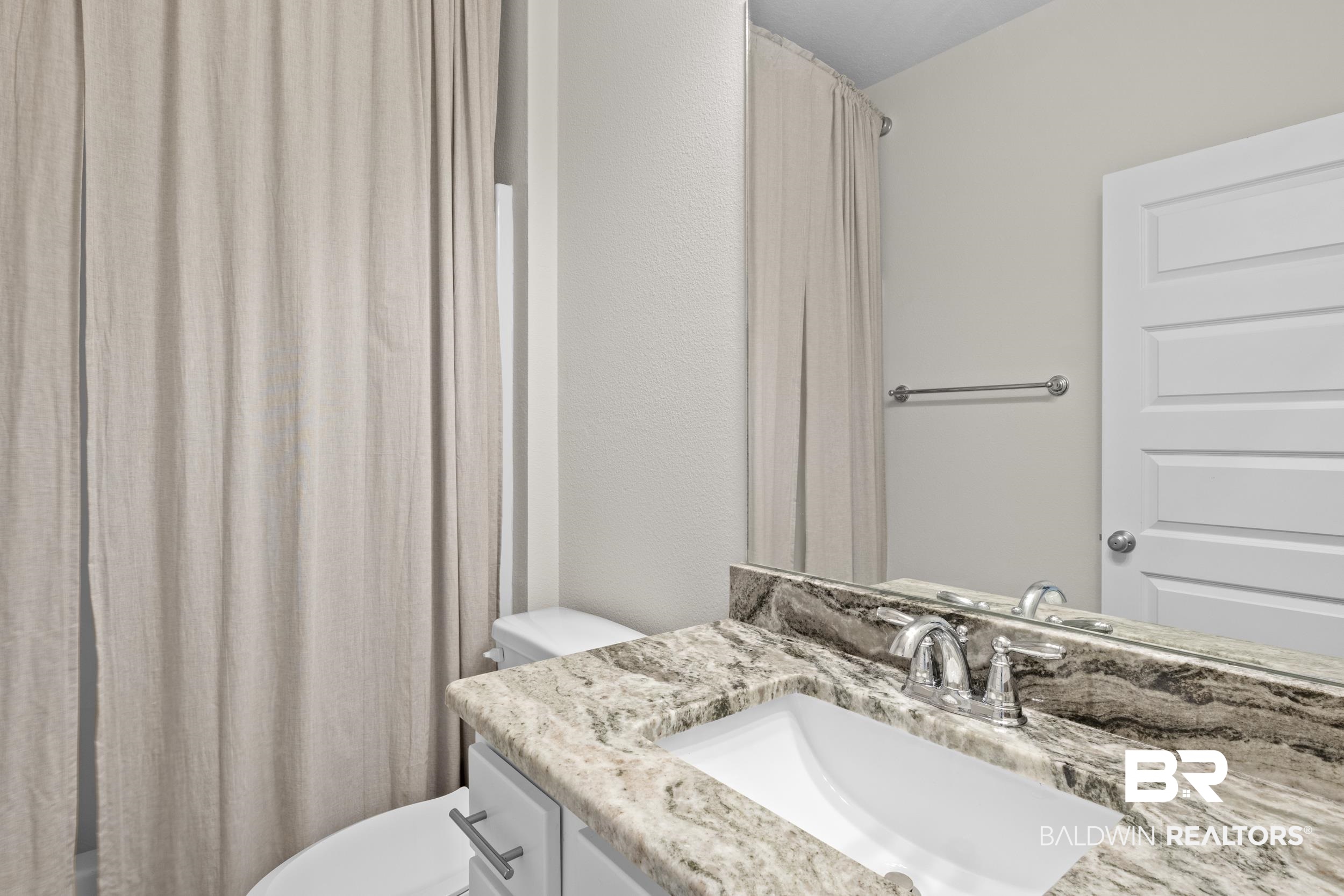 9868 Lakeview Drive Foley, AL 36535 - Photo 29 of 30 Bathroom with vanity and toilet
